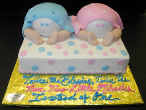 Baby Bottom Twin Cake with blue and pink decorations