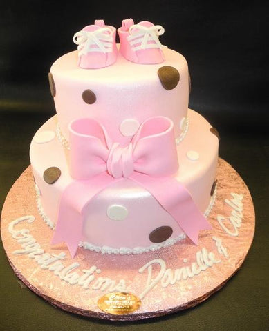 Pink and Brown Fondant Cake with Edible Booties On Top 
