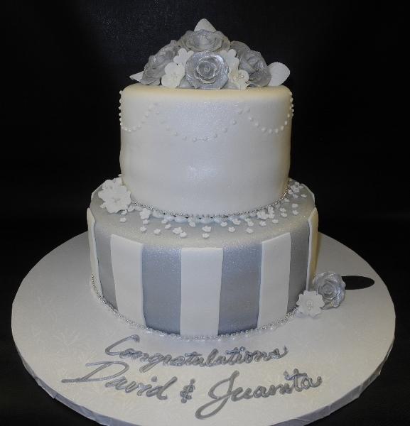 White Wedding Cake with Silver Ribbon and Red Roses