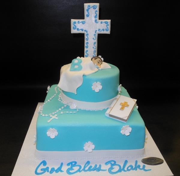 Blue and White Cross Cake Baby Sleeping on Top