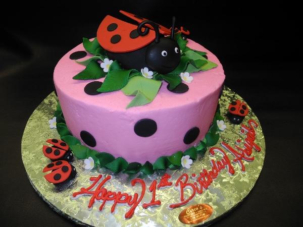 Lady Bug Pink Icing Cake with Fondant Dots and edible lady bugs